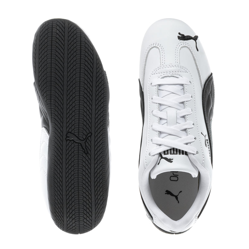 Women's white leather sneaker with black outsole tread and lace-up toe view