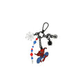 Spider-themed bag charm with red-and-blue hero figure, web charm, and beaded chain