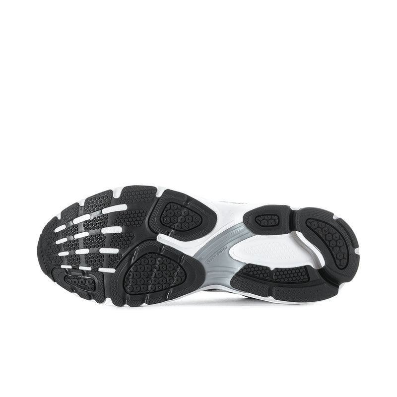 Shoe outsole view with dark tread sections and white midsole platform.