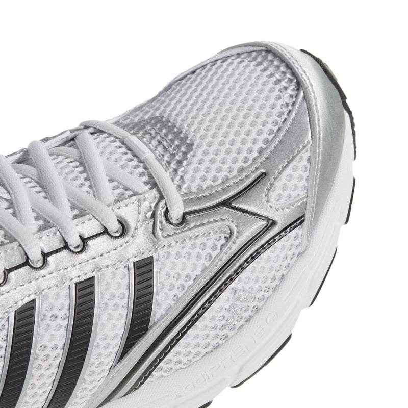 Close-up of men's sneaker side, white textured mesh with black stripe accents.