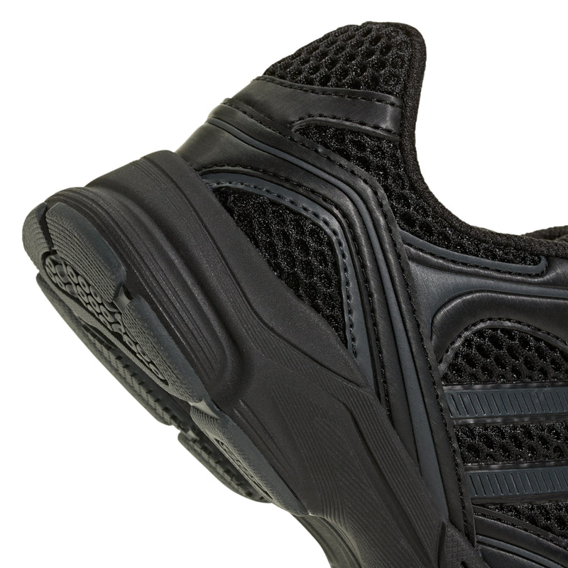 Kids black sneaker close-up of heel and textured rubber sidewall