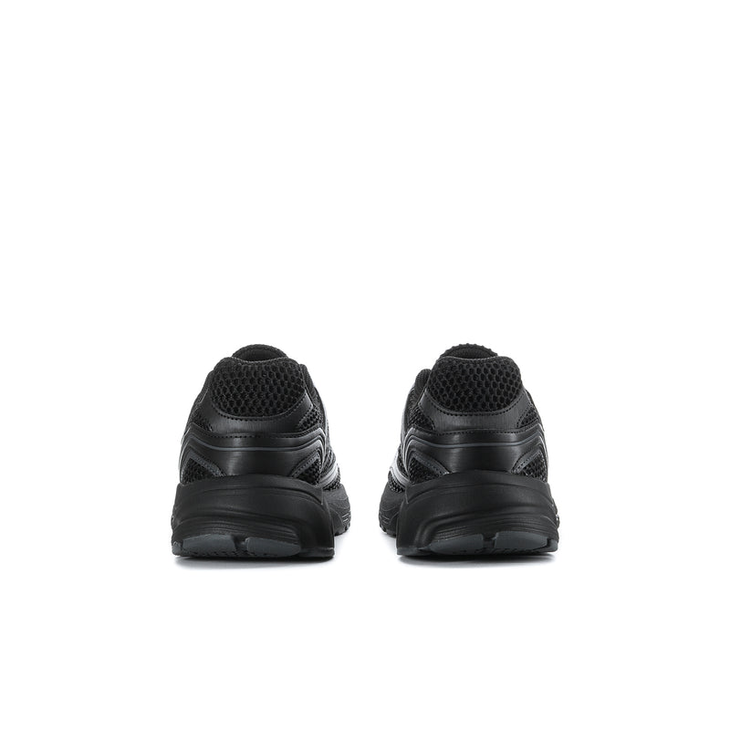 Youth black sneakers, rear view with textured heel panel and pull tab