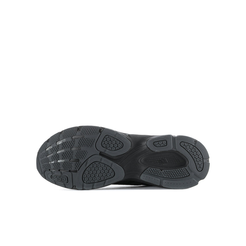 Youth black sneakers, outsole view with patterned traction tread