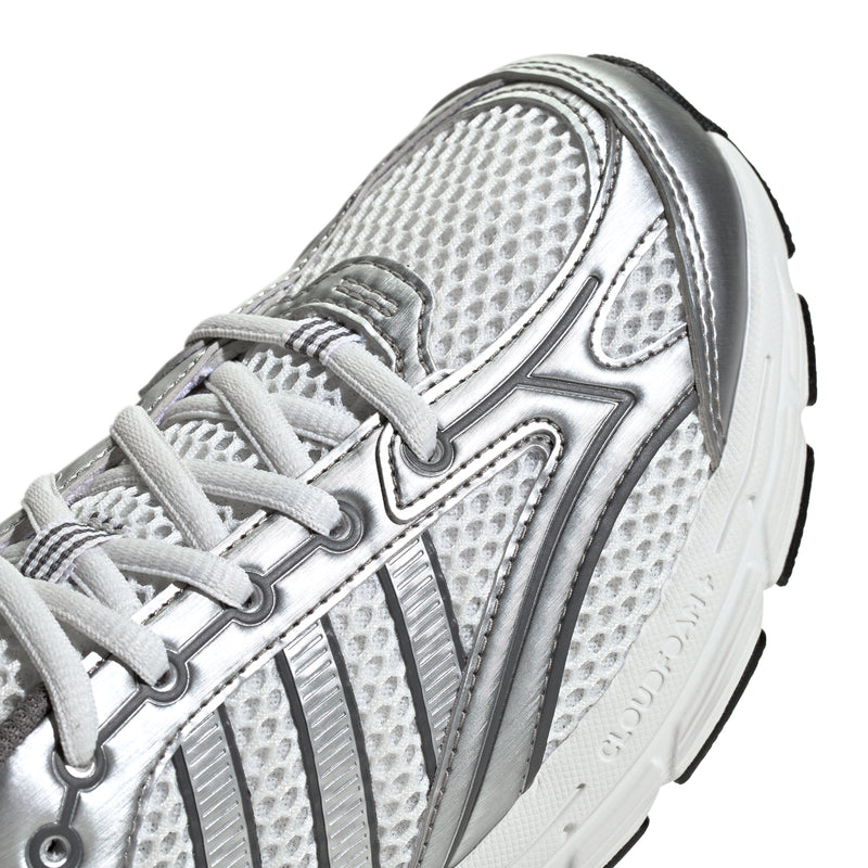 Youth running shoe close-up, light grey mesh with adidas logo and lace-up panel