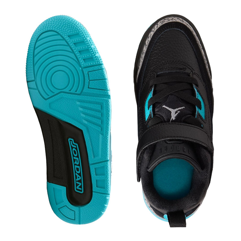 Kids black low-top sneakers with turquoise outsole and teal interior detail