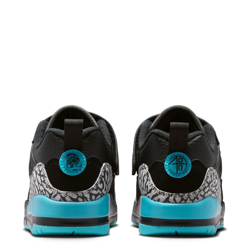 Kids black low-top sneakers with grey patterned heel, turquoise heel tabs, rear view