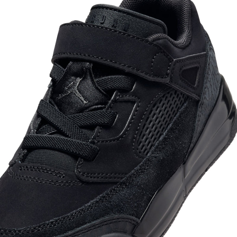 Kids black sneaker upper close-up with stitched overlays, mesh and strap