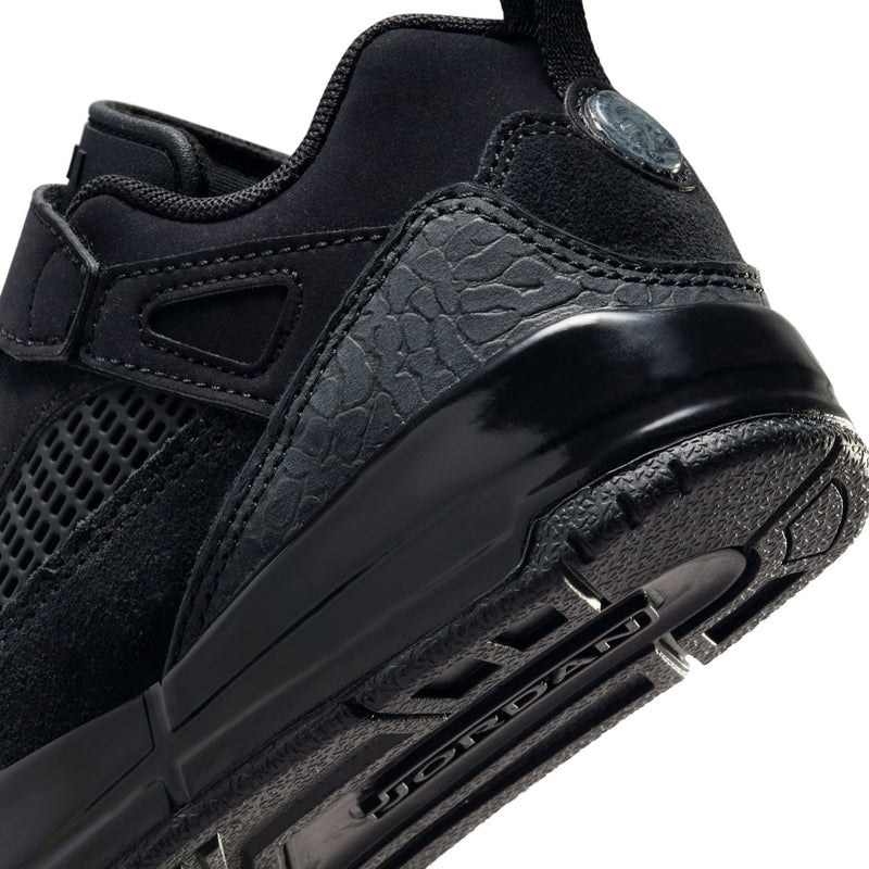 Kids black sneaker side close-up with patterned panel and lace hardware