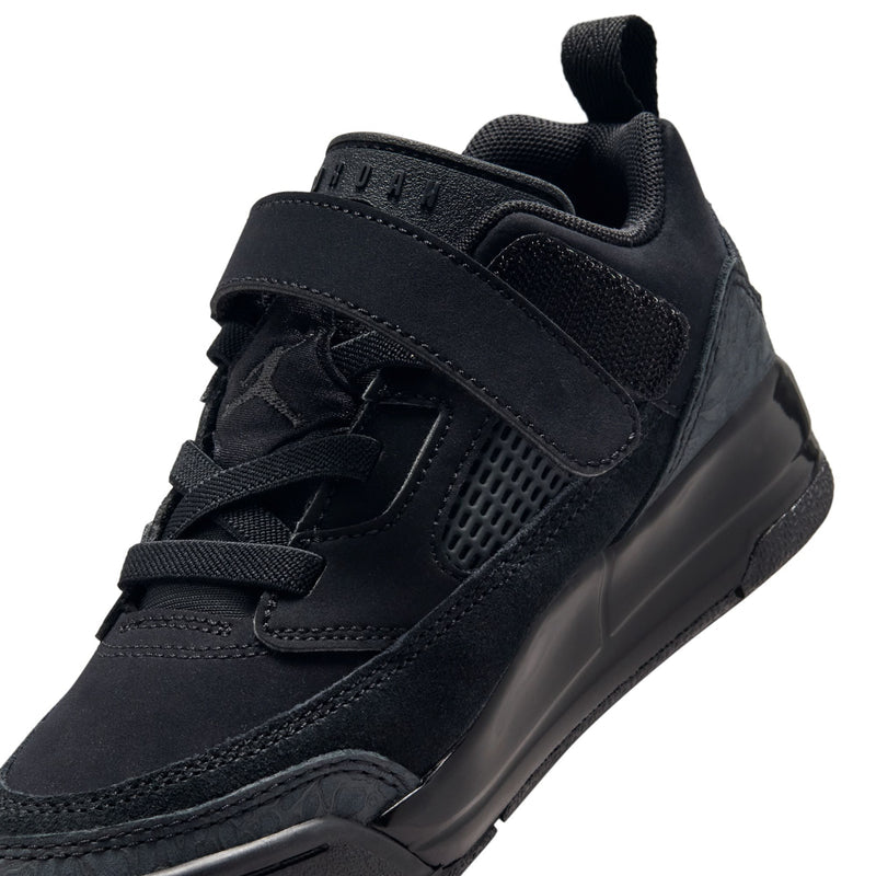 Kids black low-top sneakers, top view with hook-and-loop strap and mesh