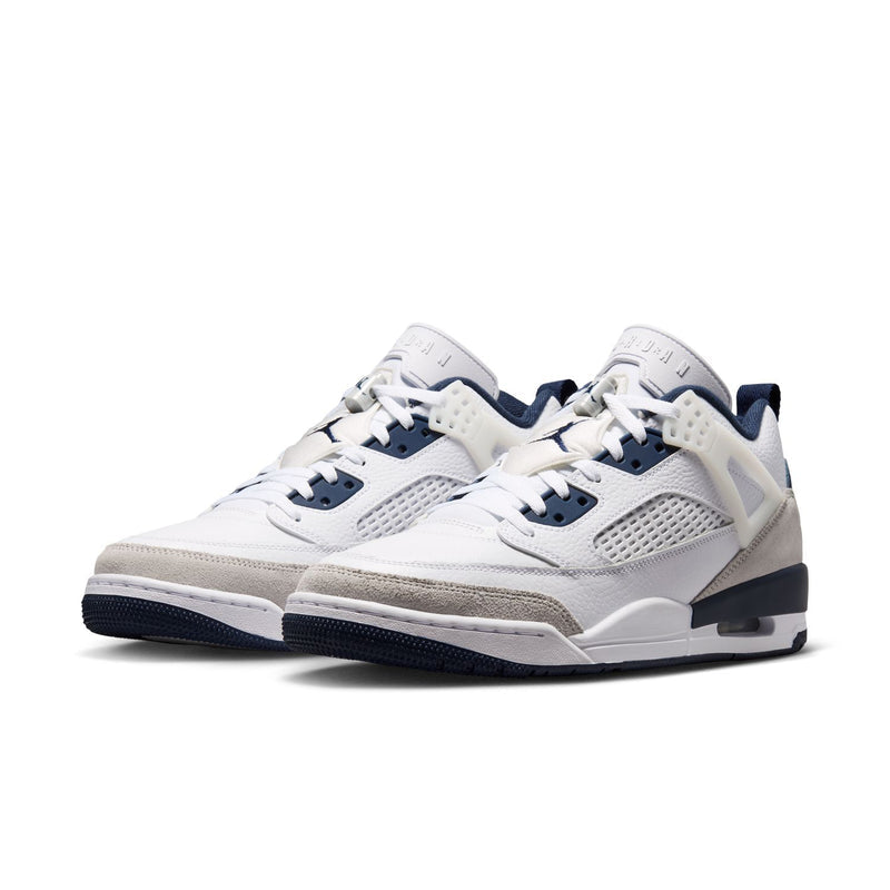 Men's low-top sneakers, white upper with navy panels, lace-up, side profile