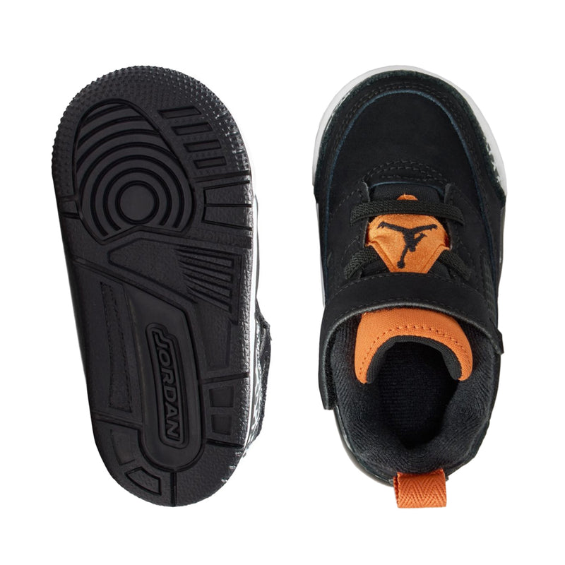 Toddler sneaker outsole and heel interior in black, with orange accent tab