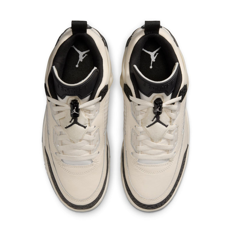 Women’s cream lace-up sneakers with black tongue lining and Jumpman logo.