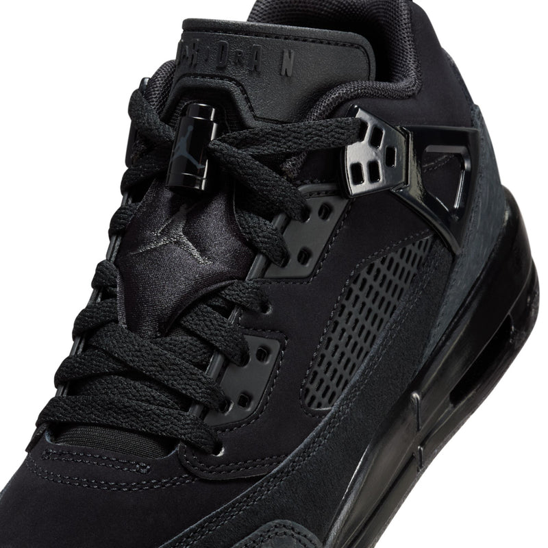 Black youth sneaker upper detail with padded collar, lace eyelets, and strap