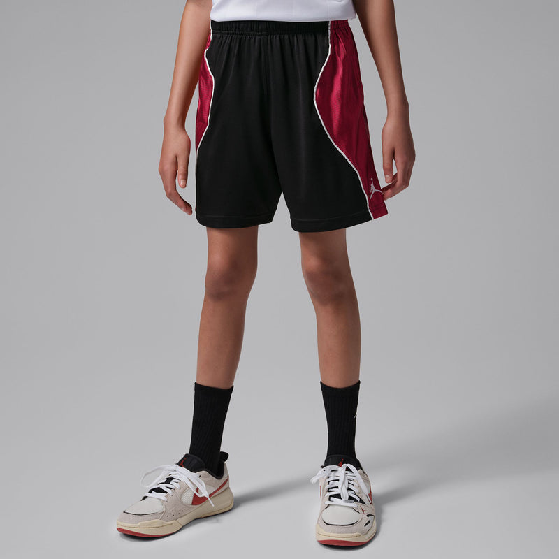 Youth black athletic shorts with gym red side panels and contrast piping, elastic waistband