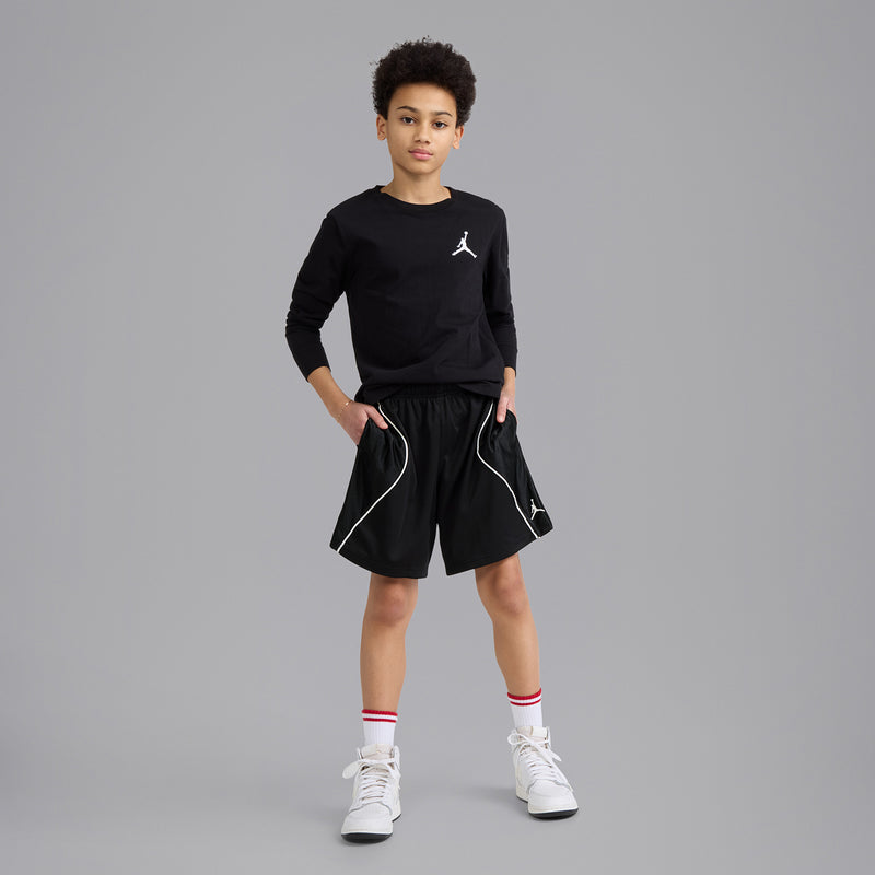 Youth black athletic shorts with white piping and small Jordan logo, elastic waistband.