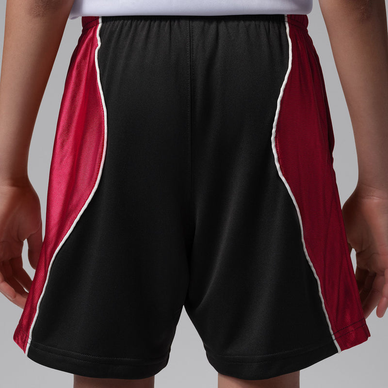 Youth black athletic shorts with gym red side panels and contrast piping along seams