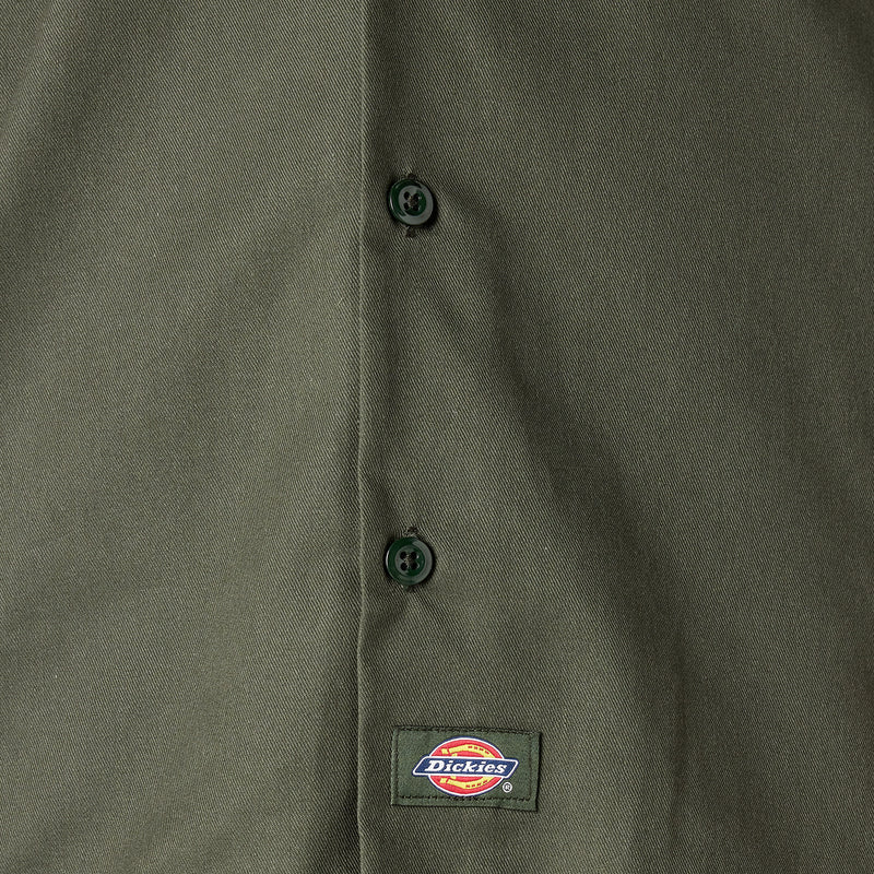 Olive green work shirt close-up with buttons and Dickies label at chest