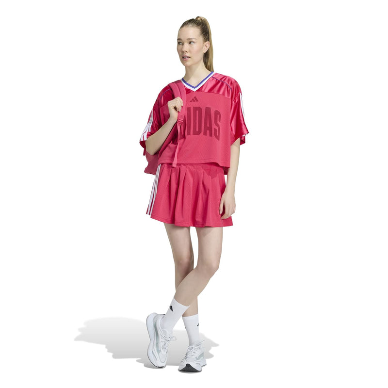 Women's power pink mesh tee worn with matching skirt, short relaxed fit