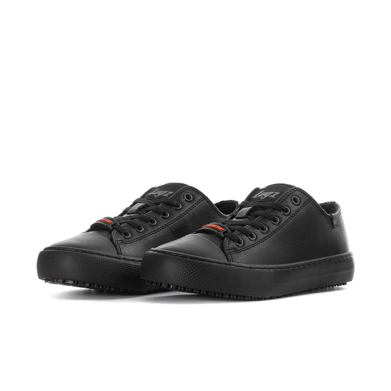 Pair of women's black low-top lace-up sneakers with textured rubber sole