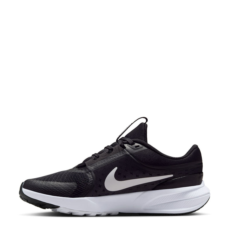 Youth black running sneaker with white swoosh and lace-up collar