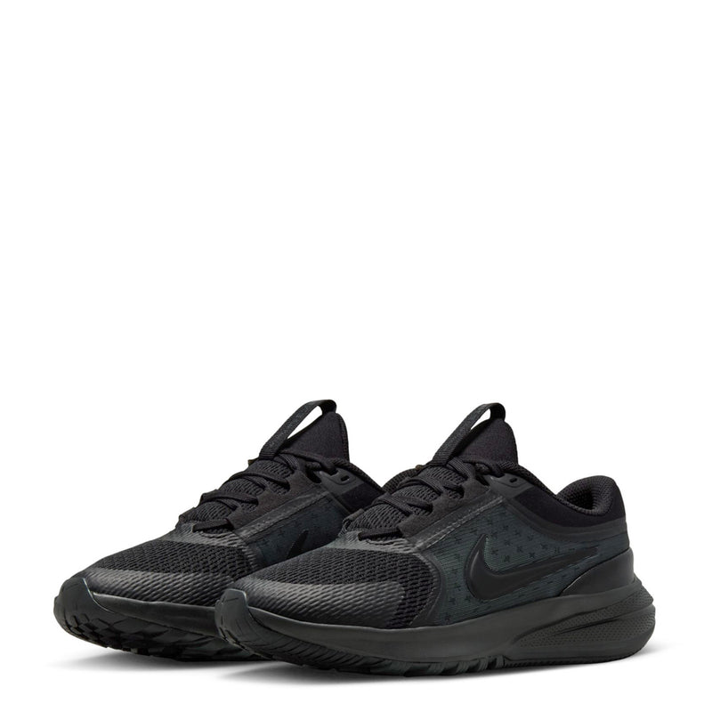 Youth black running shoes, angled side view with mesh upper and thick rubber sole
