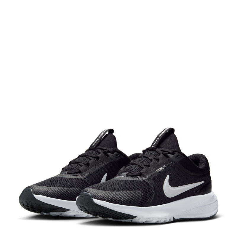 Youth black running sneakers pair view with white swoosh and thick white midsole
