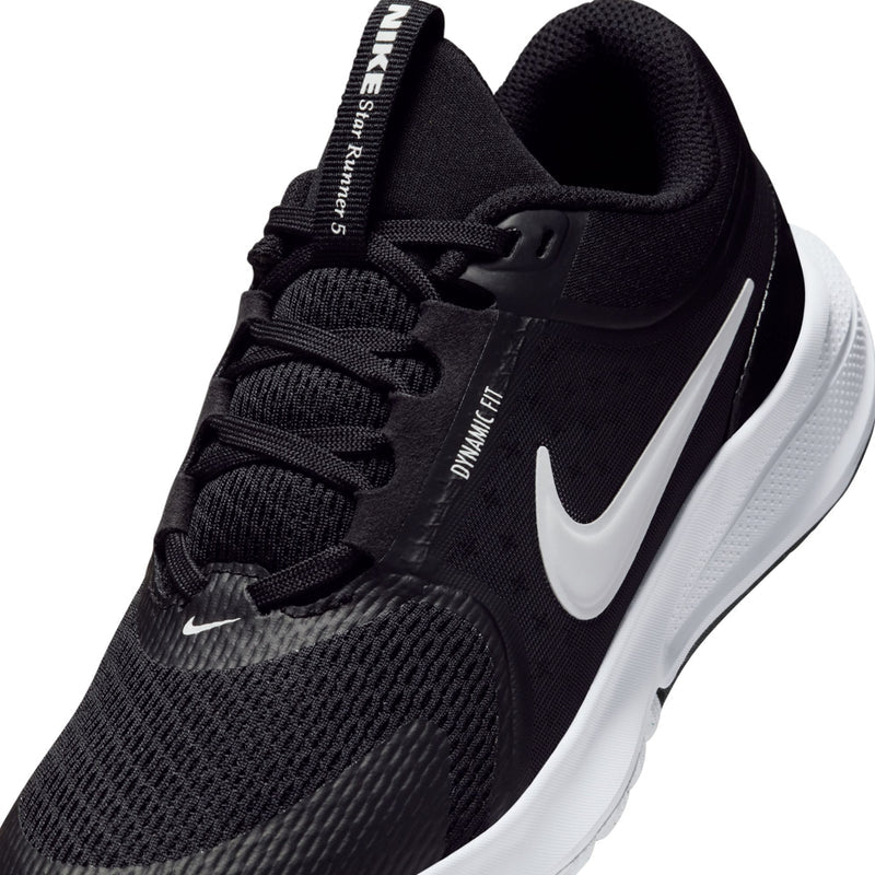 Youth black knit upper close-up with white Nike swoosh and lace details