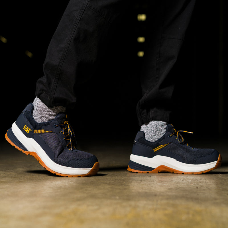 Men's CAT safety sneaker, navy knit upper with white sole and orange-brown outsole