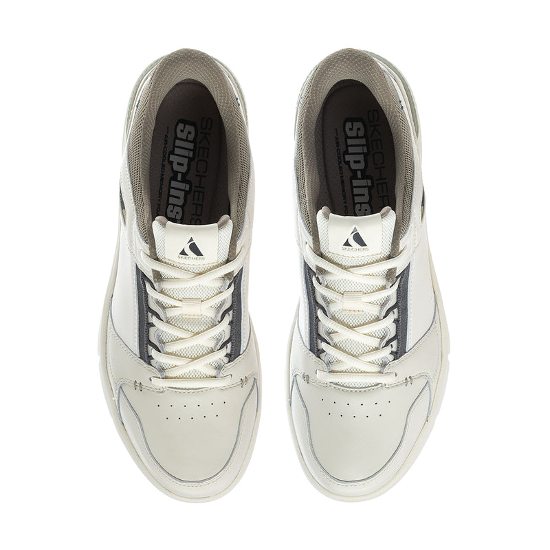 White sneakers with lace-up front and dark interior lining; cushioned tongue