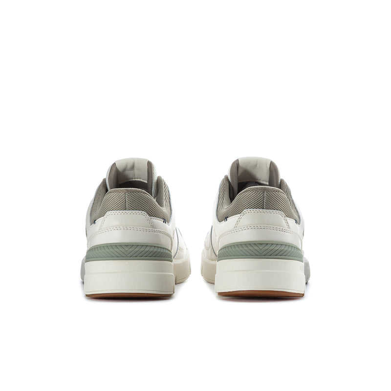 White sneakers with green heel stripe and back view of the collar