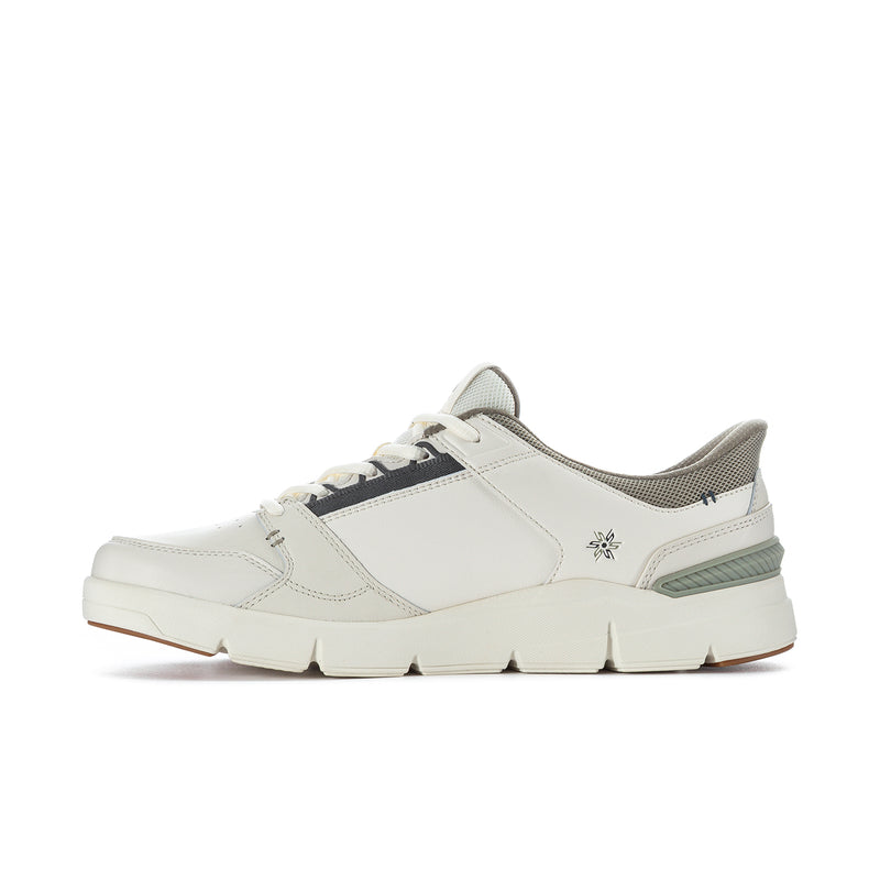 White low-top sneakers with green side stripe and small side logo detail