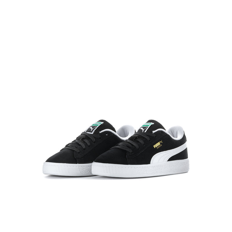 Kids PUMA suede sneakers, black uppers with white midsole and green/yellow accents.
