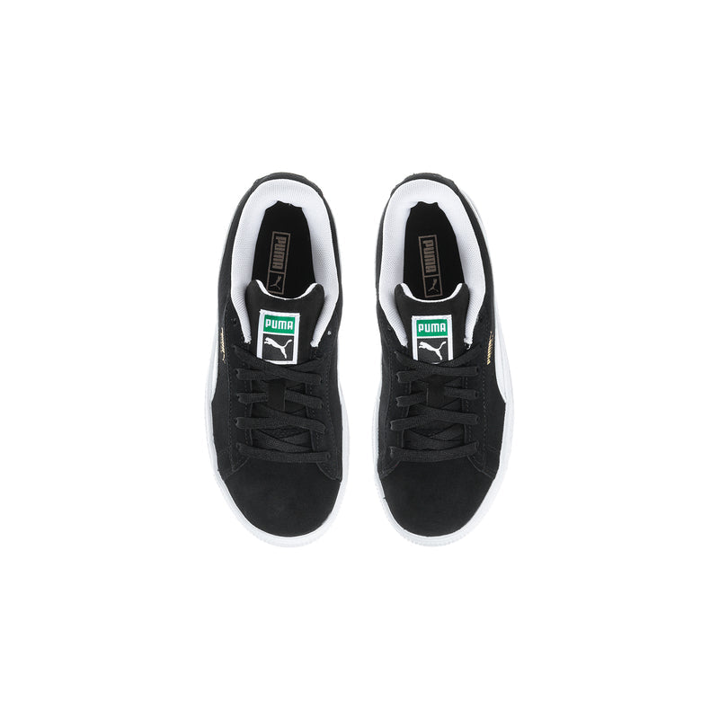 Pair of kids black suede sneakers with white lining and PUMA tongue logo.