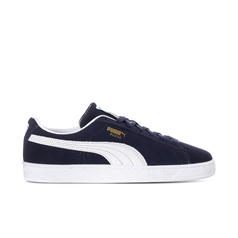 Men's navy suede low-top sneakers with white Puma stripe, laces, and rubber sole