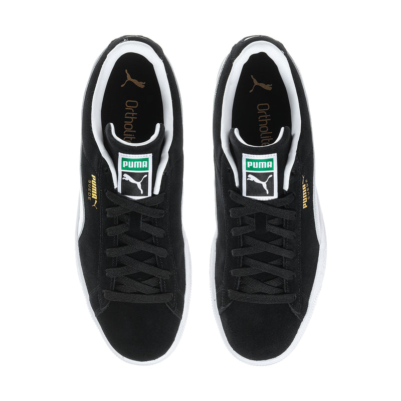 Black suede sneakers, front interior view with lace-up eyelets and branding