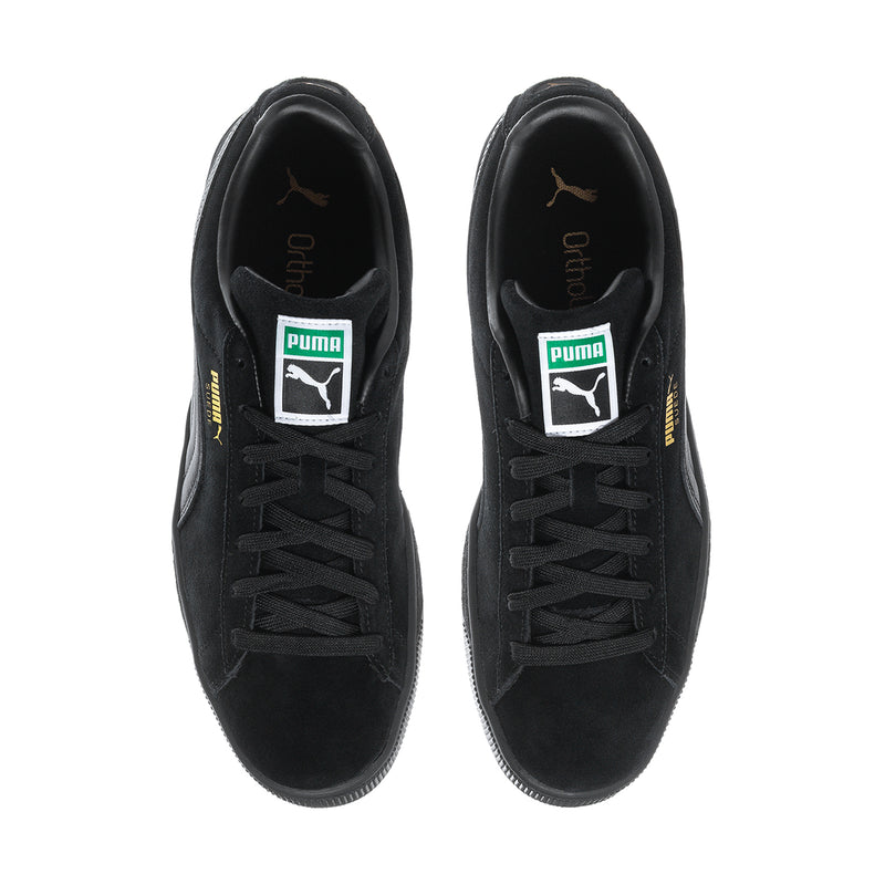 Black suede low-top sneakers front view with lace-up and Puma tongue labels.