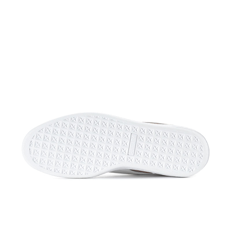 Suede sneaker outsole in white with textured rubber tread