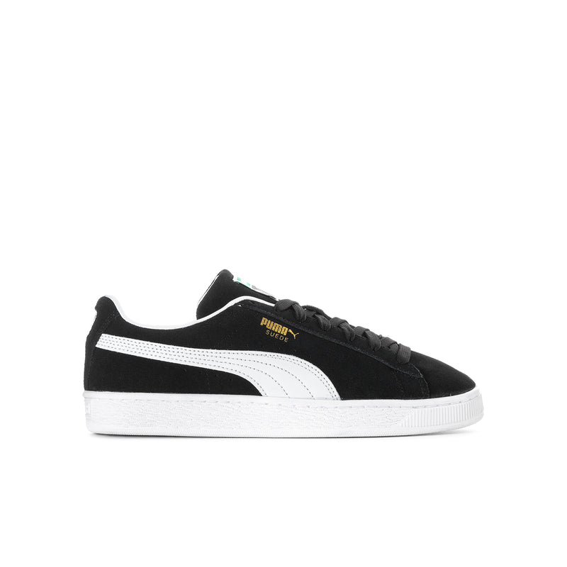 Youth suede sneakers in black with white Puma stripe and lace-up design