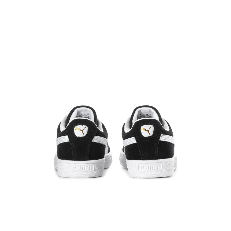 Youth black suede sneakers with white heel trim and Puma logo on back