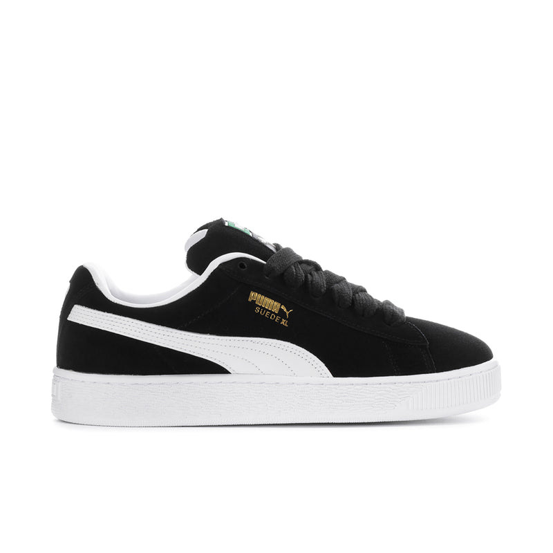 Mens black suede sneakers with white Puma stripe and white rubber sole