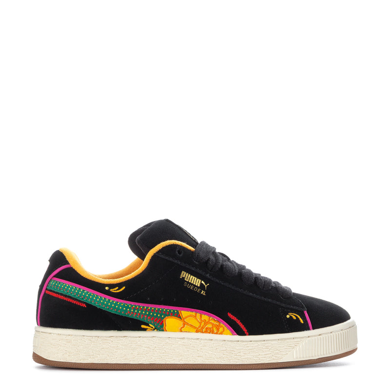Black lace-up suede sneakers with colorful Dia de Muertos graphic and off-white sole.