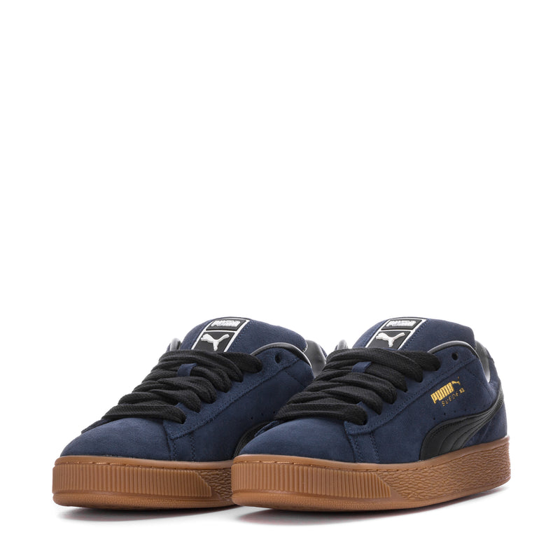 Pair of men's navy suede low-top sneakers, black laces, gum outsoles
