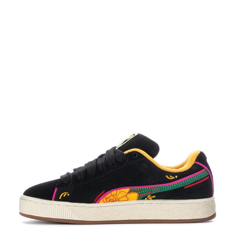 Black suede low-top sneakers with multicolor side stripe, center graphic, and off-white sole.