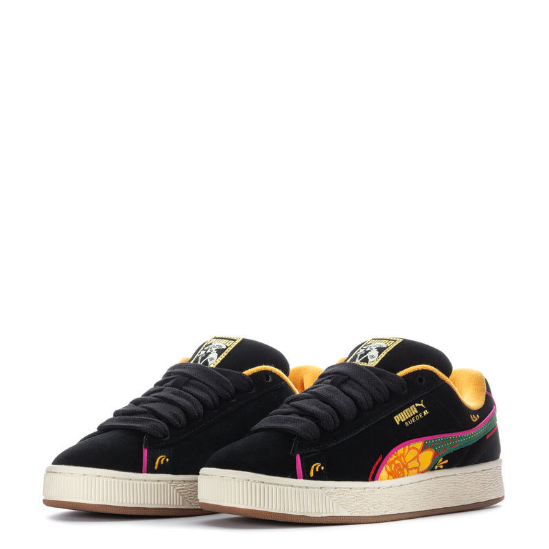 Pair of black suede lace-up sneakers with colorful side artwork and off-white soles.
