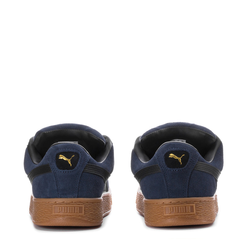 Men's navy suede sneakers, rear view with PUMA logo and gum heel tab