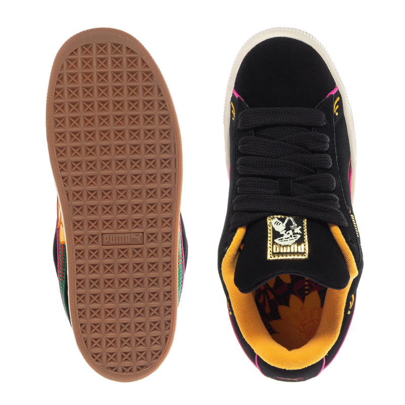 Black suede sneakers with gum outsole and black laces; yellow interior lining.