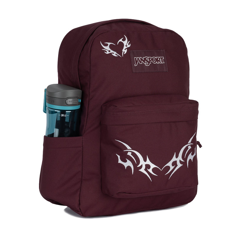 Burgundy Jansport backpack with side pocket holding a water bottle