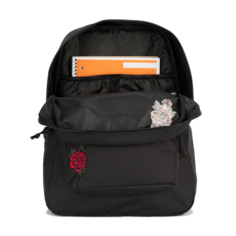 Black backpack with open front pocket holding an orange folder