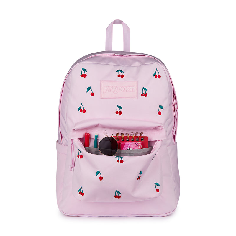 Pink cherry-print backpack with open front pocket and visible supplies inside