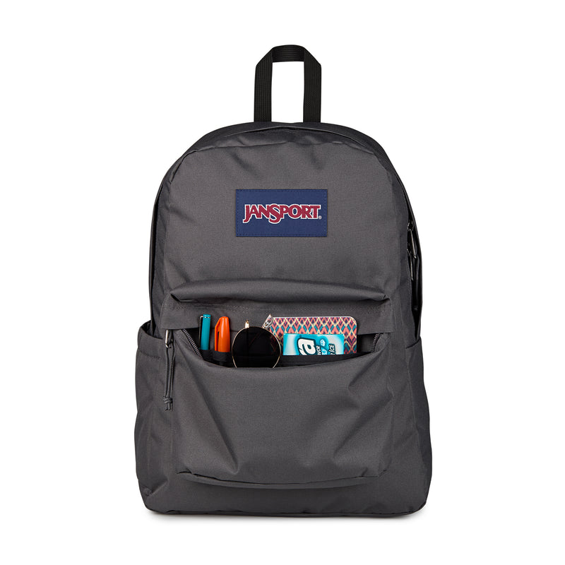 Dark gray Jansport backpack with front pocket open, showing small items inside.